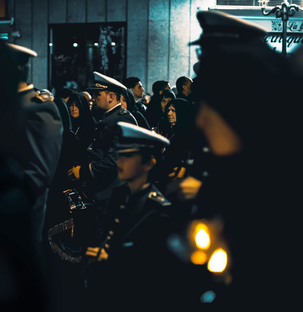 Zamora, Spain - March 31, 2018: Band of cornets and drums and Ladies of the Virgin of Solitude during holy week (semana santa) in Zamora, Spain. The ladies wear rigorous mourning, with a black cloak with a cap, with a distinctive medal and with a glass tuのeditorial素材