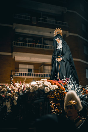 Zamora, Spain - March 31, 2018: Virgin of Solitude (Virgen de la Soledad) during holy week (semana santa) in Zamora, Spain. Carved in pine wood and In the procession it is placed on a mahogany table.のeditorial素材