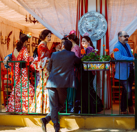 Sevilla, Spain - April 18, 2018: Families and friends enjoy at fair tent. April Fair, Seville Fair (Feria de Sevilla). The Seville Fair (officially and in Spanish: Feria de abril de Sevilla, "Seville April Fair") is held in Andalusian capital of Seville, のeditorial素材