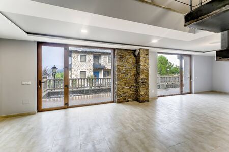 Empty and unfurnished brand new modern house. Beautiful big living room.の写真素材