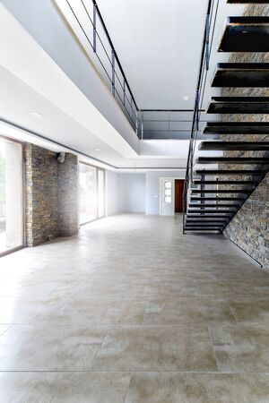Interior modern empty house. Beautiful living room without furniture.の写真素材