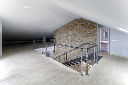 Indoor view of an empty attic of a new modern house.の写真素材
