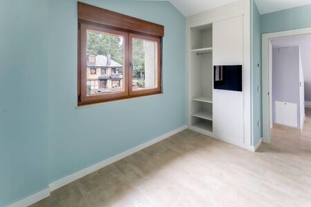 New beautiful empty bedroom with large window. Interior modern room.の写真素材