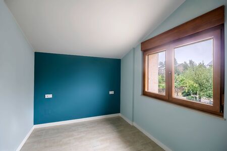 New beautiful empty bedroom with large window. Interior modern room.の写真素材