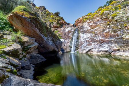 Colorfull River waterfall in mountain. Waterfall mountain wall scene. Mountain waterfall viewの写真素材