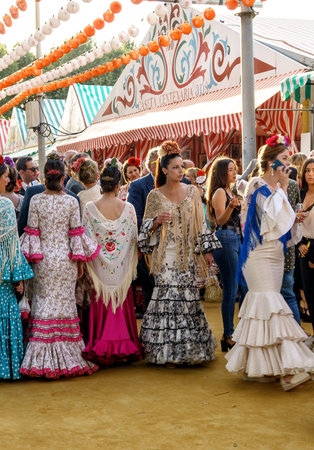 Seville, Spain - May 09, 2019 : Beautiful Woman wearing flamenco dress at the April Fair (Feria de Abril), Seville Fair (Feria de Sevilla), Andalusia, Spainのeditorial素材