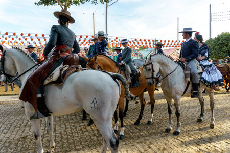 Seville, Spain - May 07, 2019 : Riders on horseback dressed in traditional costumes at the April Fair (Feria de Abril), Seville Fair (Feria de Sevilla), Andalusia, Spainのeditorial素材