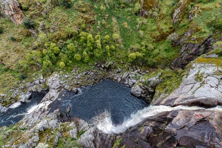 Pozo de los Humos (smoke pit) waterfall in spring forest at Salamanca, Spain.の写真素材