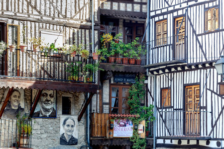 Mogarraz, Spain - April 20, 2019: Portraits of Mogarraz. Images of neighbors past and present guard the streets of this charming alpine village. Portraits are based on a series of 388 photographs taken in 1967, After more than 50 years  local artist Floreのeditorial素材