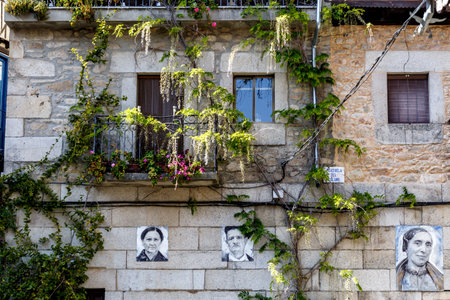 Mogarraz, Spain - April 20, 2019: Portraits of Mogarraz. Images of neighbors past and present guard the streets of this charming alpine village. Portraits are based on a series of 388 photographs taken in 1967, After more than 50 years  local artist Floreのeditorial素材