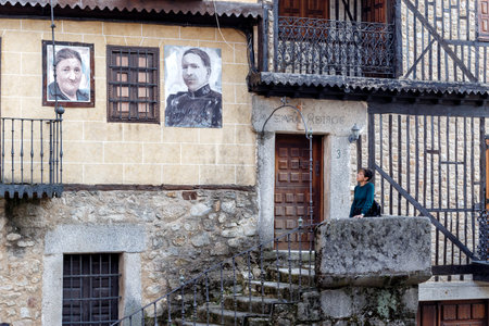 Mogarraz, Spain - April 20, 2019: Portraits of Mogarraz. Images of neighbors past and present guard the streets of this charming alpine village. Portraits are based on a series of 388 photographs taken in 1967, After more than 50 years  local artist Floreのeditorial素材