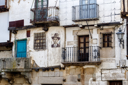 Mogarraz, Spain - April 20, 2019: Portraits of Mogarraz. Images of neighbors past and present guard the streets of this charming alpine village. Portraits are based on a series of 388 photographs taken in 1967, After more than 50 years  local artist Floreのeditorial素材