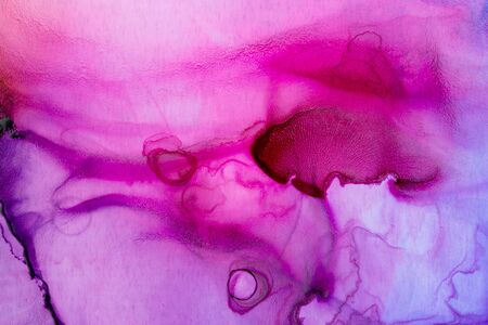 Vivid pink and purple alcohol ink abstract background. Hand painted and Ethereal ink texture.の写真素材