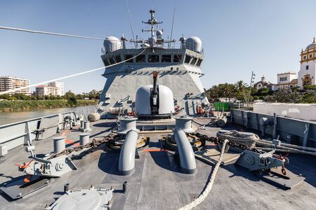 Maritime action warship. Naval artillery mounted on the deck. Front view.の写真素材