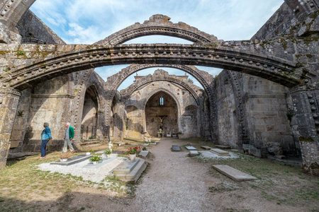 Pontevedra, Spain - August 18, 2019: Tourists visiting Santa MariÃ±a de Dozo in Cambados, Spain. Ruins of a gothic church built in the fifteenth century.のeditorial素材