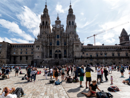 Santiago de Compostela, Spain - August 20 2019: Pilgrims and tourists in the Plaza del Obradoiro.. The Plaza del Obradoiro is the largest of its kind in the whole of Galicia and it becomes the center point for the 25th July Saint James day.のeditorial素材