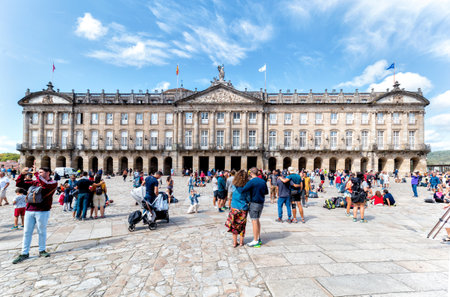 Santiago de Compostela, Spain - August 20 2019: Pilgrims and tourists in the Plaza del Obradoiro.. The Plaza del Obradoiro is the largest of its kind in the whole of Galicia and it becomes the center point for the 25th July Saint James day.のeditorial素材
