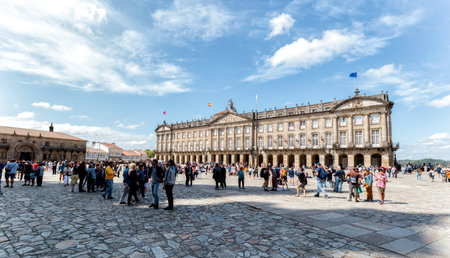 Santiago de Compostela, Spain - August 20 2019: Pilgrims and tourists in the Plaza del Obradoiro.. The Plaza del Obradoiro is the largest of its kind in the whole of Galicia and it becomes the center point for the 25th July Saint James day.のeditorial素材