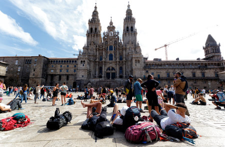 Santiago de Compostela, Spain - August 20 2019: Pilgrims and tourists in the Plaza del Obradoiro.. The Plaza del Obradoiro is the largest of its kind in the whole of Galicia and it becomes the center point for the 25th July Saint James day.のeditorial素材