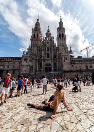 Santiago de Compostela, Spain - August 20 2019: Pilgrims and tourists in the Plaza del Obradoiro.. The Plaza del Obradoiro is the largest of its kind in the whole of Galicia and it becomes the center point for the 25th July Saint James day.のeditorial素材