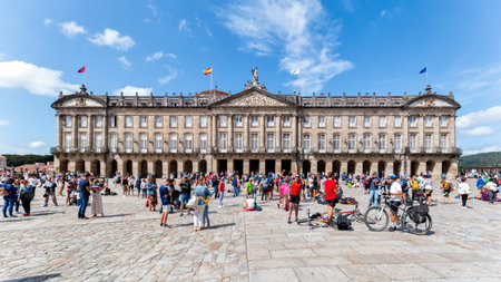 Santiago de Compostela, Spain - August 20 2019: Pilgrims and tourists in the Plaza del Obradoiro.. The Plaza del Obradoiro is the largest of its kind in the whole of Galicia and it becomes the center point for the 25th July Saint James day.のeditorial素材