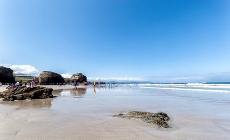 Ribadeo, Spain - August 21 2019: Cathedrals beach. Designated a Natural Monument, is one of the most famous beaches in Galicia. It is known around the world for its rocky formations carved by the wind and sea.のeditorial素材