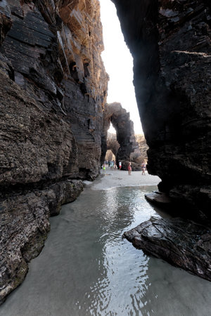 Ribadeo, Spain - August 21 2019: Cathedrals beach. Designated a Natural Monument, is one of the most famous beaches in Galicia. It is known around the world for its rocky formations carved by the wind and sea.のeditorial素材