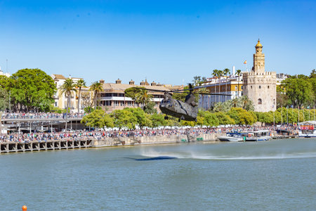 Seville, Spain - May 31, 2019: Military helicopter flying over the Guadalquivir river during display of Spanish Armed Forces Day in Seville, Spainのeditorial素材