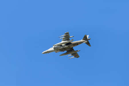 Modern armed military transport planes flys in formation through the sky.