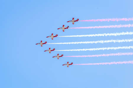 Modern armed military transport planes flys in formation through the sky.の写真素材