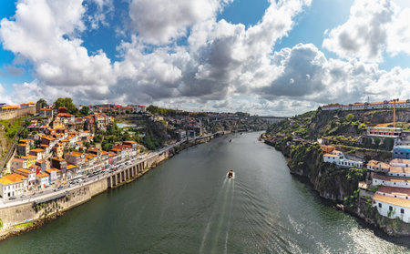 Picturesque cityscape image of Porto (Oporto), Portugal from the famous Luis I Bridge and the Douro River.の写真素材