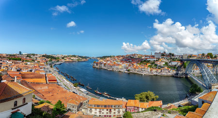Panoramic view of the old city center of Porto (Oporto), Portugal with the famous Luis I Bridge and the Douro River.のeditorial素材