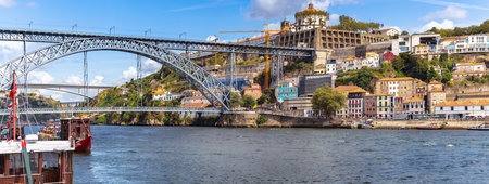 Porto, Portugal - August 11, 2019: People enjoy the sunny and warm on the riverside quay of Porto. Porto has been recognized internationally as a destination to discover and it is a preferred choice for many tourists and travelers.のeditorial素材