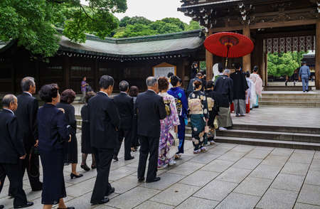 Tokyo, Japan - July 19, 2009: Japanese wedding ceremony at Meiji Jingu Shrine. Meiji Jingu Shrine is...