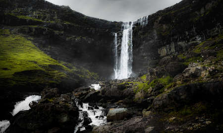 Stunning view of Fossa Waterfall on the eastern cost of Streymoy Island. Fossa is the largest...