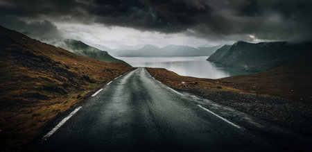 View of countryside road near sea during trip roaming the curvy roads at the coastal line of the...