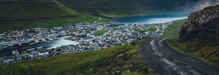 Beautiful view of the City of Klaksvik in the Faroe Islands with its colorful houses and amazing canal and view to the Kunoy Park.の写真素材