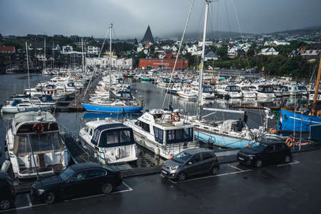 Torshavn, Faroe Islands - July 22, 2019: Fishing boats in Torshavn marina harbor on Faroe islands. Torshavn Harbor located in the south eastern part of Streymoy is the largest and busiest port in the Faroe Islands.のeditorial素材