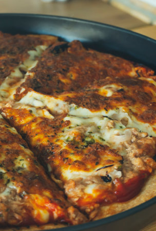 Tasty pizza with melting buffalo mozzarella, delicious tuna and green pepper. Tasty fast food...