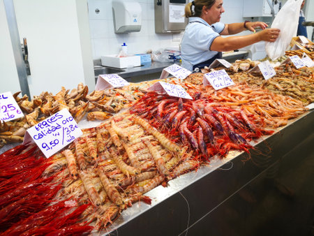Cadiz, Spain - August 03, 2023: Cadiz Fish Market. Stunning Fresh fish stall in The Central Market of CÃ¡diz, Andalusia, Spain. It is the oldest covered market in Spain and where the Atlantic Ocean offers the freshest fish and seafood in Spain with piles のeditorial素材