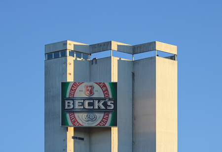 Bremen, Germany - January 7th, 2018 - Silo at the Beck's brewery with large company logoのeditorial素材
