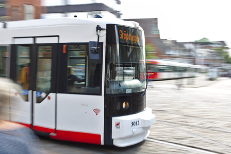 Bremen, Germany - July 10th, 2018 - First car of a tram passing by (motion blur, long exposure)のeditorial素材
