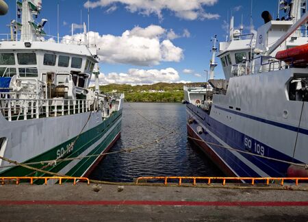 Killybegs, Co. Donegal, Ireland - May 21st, 2019 - Two fishing vessels moored at the pierのeditorial素材