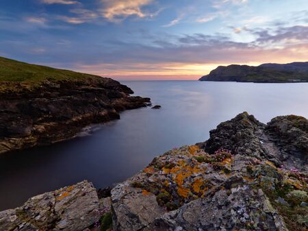 The rocky shores of Tawny Bay, Co. Donegal on the Irish west coast at sunset.の写真素材