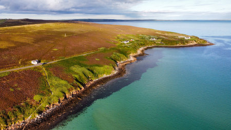 Aerial shot of Waulkmill Bay, Orkney at high tide with view out towards Scapa Flowの写真素材
