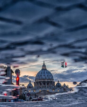 cloudy day on Vatican dome the river bridge is a roman architectureの写真素材