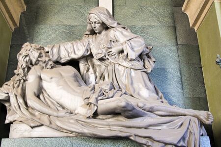 Statue of the Virgin Mary who places Christ on the Sindone with great painの写真素材