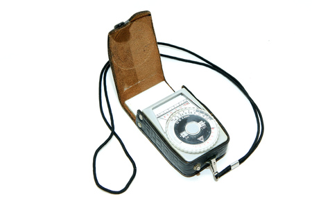 The old soviet exposure meter isolated on a white background. A piece of vintage photo tool.の写真素材