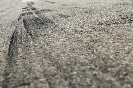 The rubber tracks from the rallye cars left on the tarmac in the hairpin.