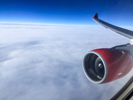 An aerial view from the airplane flying high above the ground. A look from the planeÂ´s window...